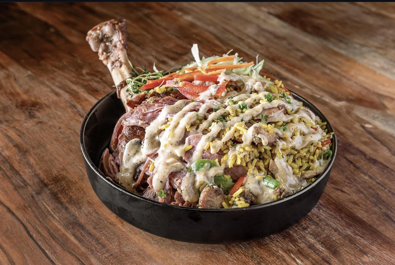 JerkCity Grille — jerk chicken plate over seasoned rice with peppers, parsnip, and white sauce drizzle