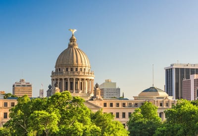 Mississippi State Capitol dome framed by downtown Jackson skyline